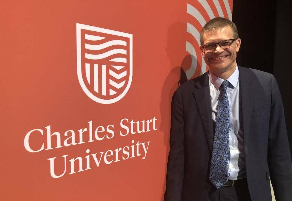 NEW LOOK: Charles Sturt University vice-chancellor Andrew Vann with the new university logo. Picture: Daina Oliver 