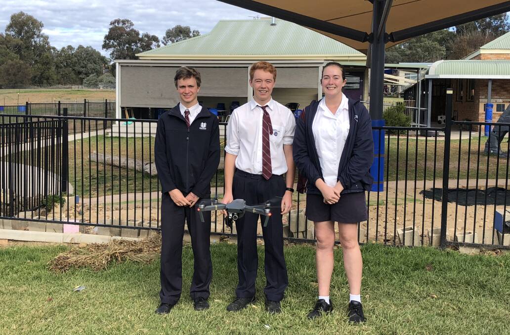 SCHOOL REPRESENTS: Calvin Combs, Noah Tasker and Chloe Hildebrand students from Wagga Wagga Christian College are proudly standing behind their drone. 