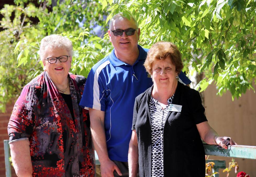 COMMUNITY SUPPORT: Barbara Johnson and Julie Morrison from Riverina CWA and Kooringal High School's SRC co-ordinator David Antill. Picture: Les Smith