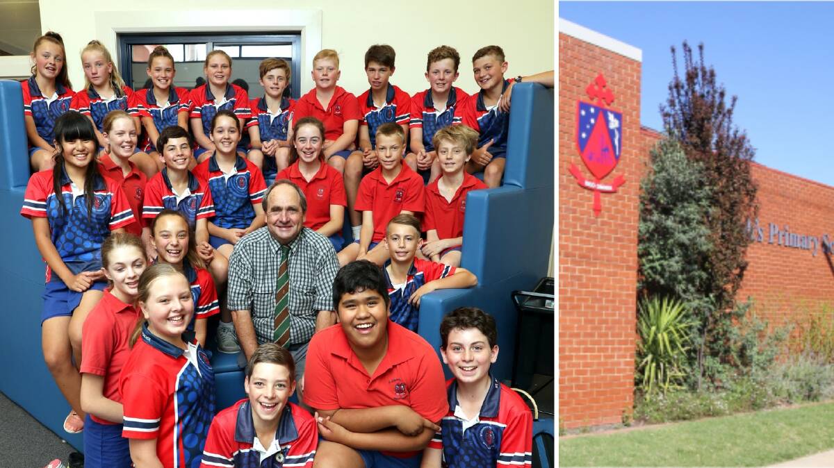 St Joseph's Year 6 teacher Paul Kennedy is surrounded by his class as he prepares to leave the school after 20 years of teaching there. Picture: Les Smith