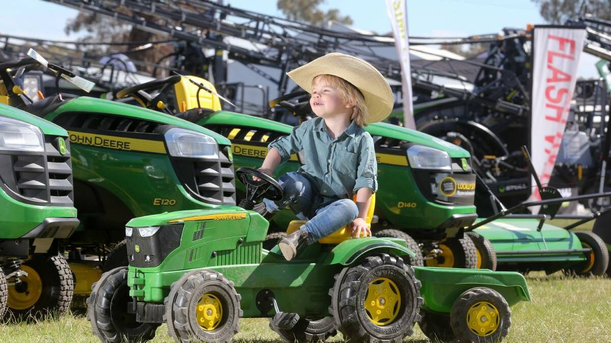 MAKING TRACKS: Three-year-old Augustus Henderson, from Bemboka, tries out a tractor at the 55th Henty Machinery Field Days and shows that young farmers are the future. 