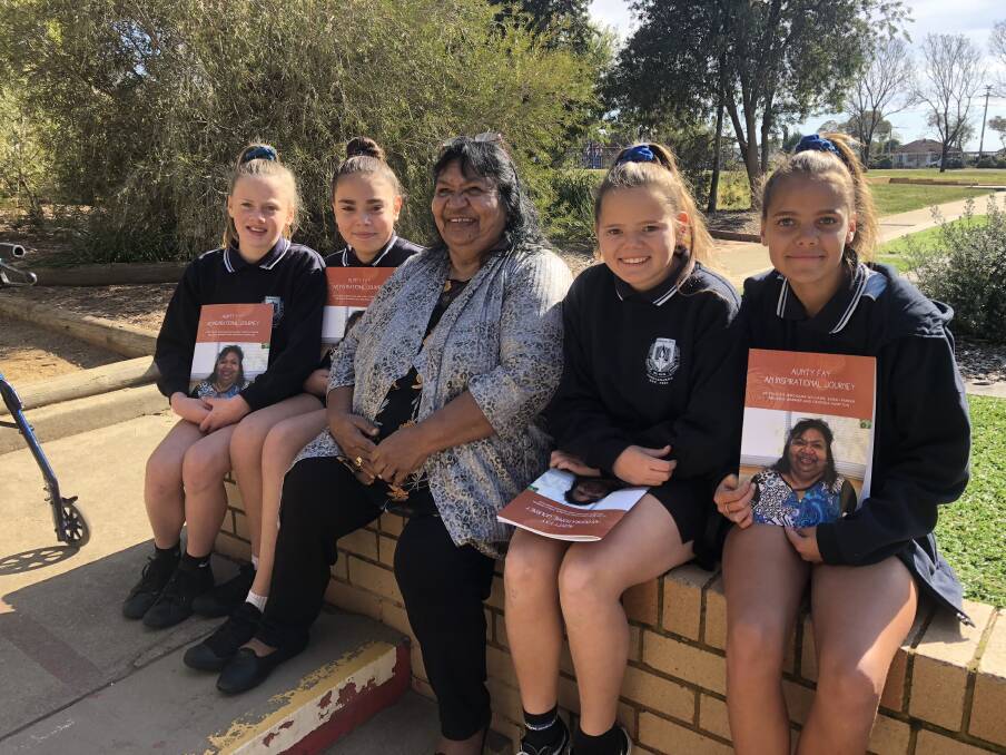 STORY POWER: Ashmont Public School grade six students Melodie Warner, Georgia Hampton, Jerchana Williams and Sarah Parker wrote a book on Aunty Fay Clayton Moseley Wiradjuri Elder's compelling journey through life. 