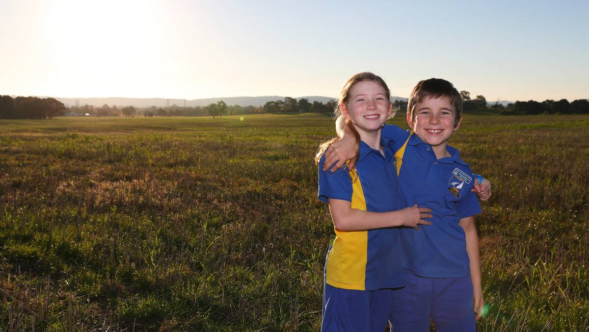 RURAL LIFESTYLE: Eight-year-old twins Xander and Jorjii McDonald say they love living on Butterbush Road because they have plenty of space to run around. Picture: Emma Hillier