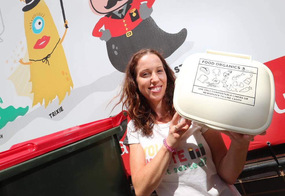Alice Kent holding the new bins system that council introduced early 2018. 
