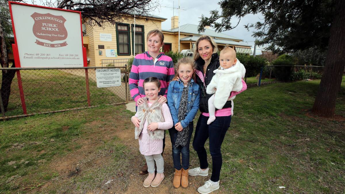 BANDING TOGETHER: Collingullie residents (FL) Pippa Lisle, 6, Kilarny Trethowan, 8, Summer Jones, 10 months, (FR) Vicky Lisle and Sara Jones prepare to build a playgroup. Picture: Les Smith
