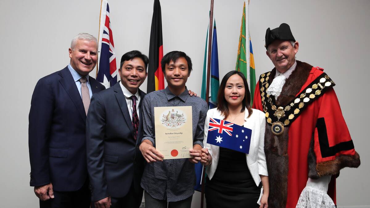 YOUNG CITIZEN: Joshua Chan, 17, with his parents Sherwin Chan and Virginia Chan, Deputy PM Michael McCormack and Wagga mayor Greg Conkey. Picture: Les Smith

