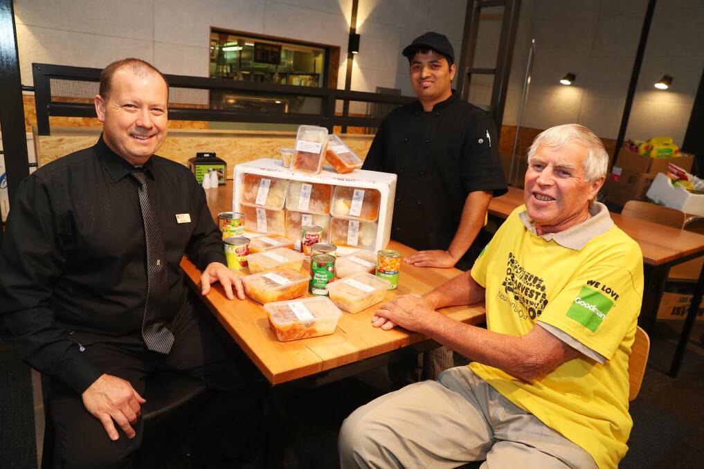 FEEDING THE NEEDY: CSU's food and beverage coordinator Toby Perry, CSU chef Benny Banstola and OzHarvest's Wagga coordinator John Foord ready to distribute meals to those less fortnuate. Picture: Emma Hillier 
