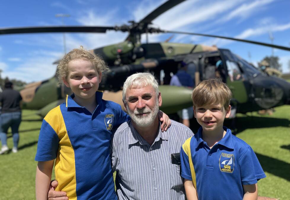 FIELD TRIP: Greg Tucker took his grandchildren Olivia and Luke out of school to witness the Black Hawks landing at Bolton Park. Picture: Monty Jacka