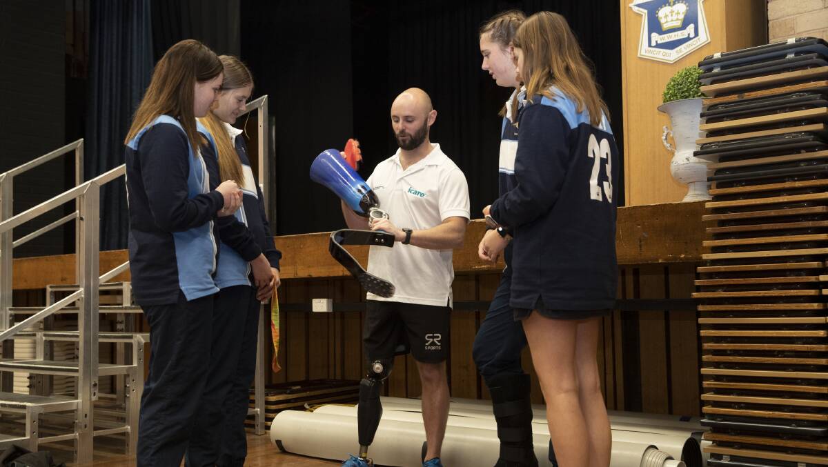 MEMORIES: Scott Reardon shows off his running blade to Wagga High School students before delivering his workplace safety speech to year 12 students. Picture: Madeline Begley