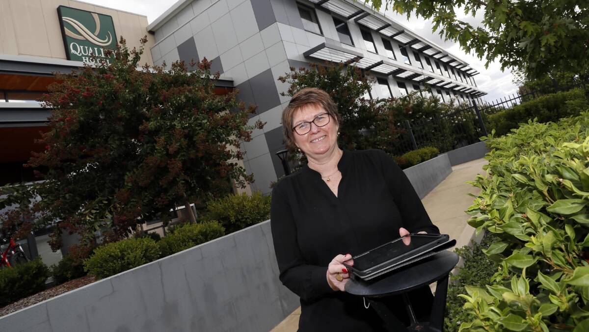 HOPEFUL: Receptionist Kerrie Tuovi outside the Rules Club Quality Hotel, one of the Wagga businesses participating in the Stay NSW voucher program. Picture: Les Smith