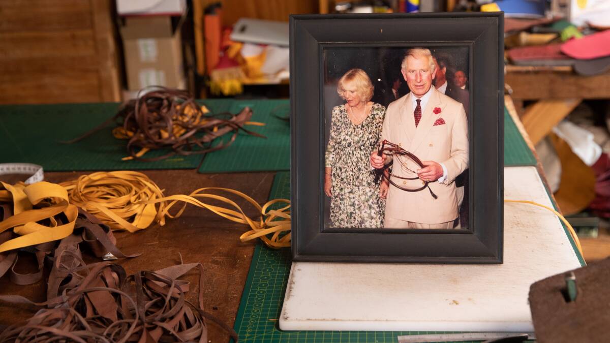 Mr Rennick has kept a framed picture of King Charles III, then Prince of Wales, holding the whip he made in his shed for the past 10 years. Picture by Madeline Begley