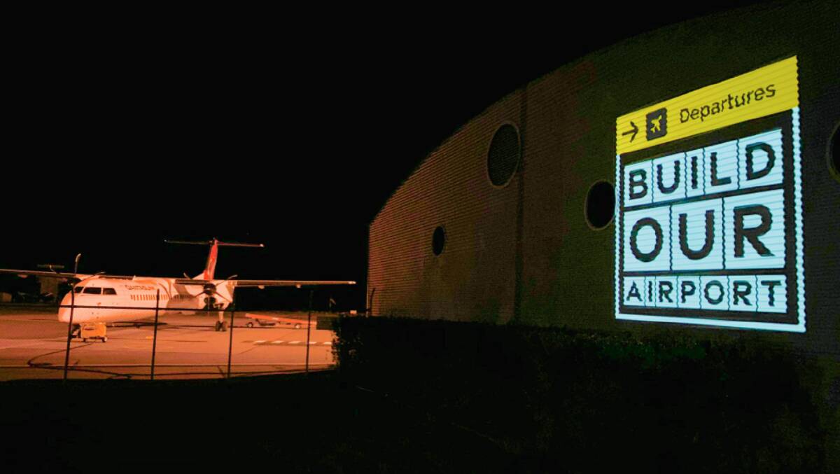 MESSAGE: Early morning travellers at Wagga Airport on Thursday were greeted by a projection which seemed to be calling for upgrades to the often criticised facility. Picture: Contributed.