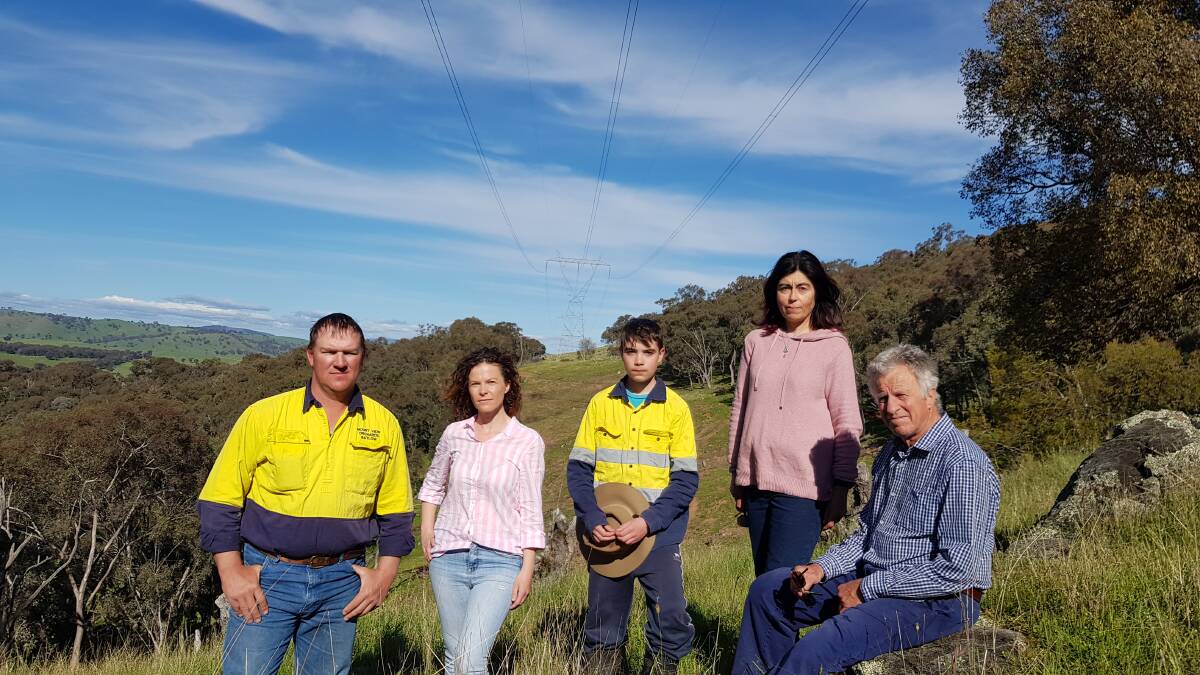 Ian Robson, Rebecca Tobin, Eli Quilty-Campbell, Pippa Quilty and Ross Smith are already fearful of the fire threat posed by the existing 330kv powerline that runs across their properties. Picture: Supplied