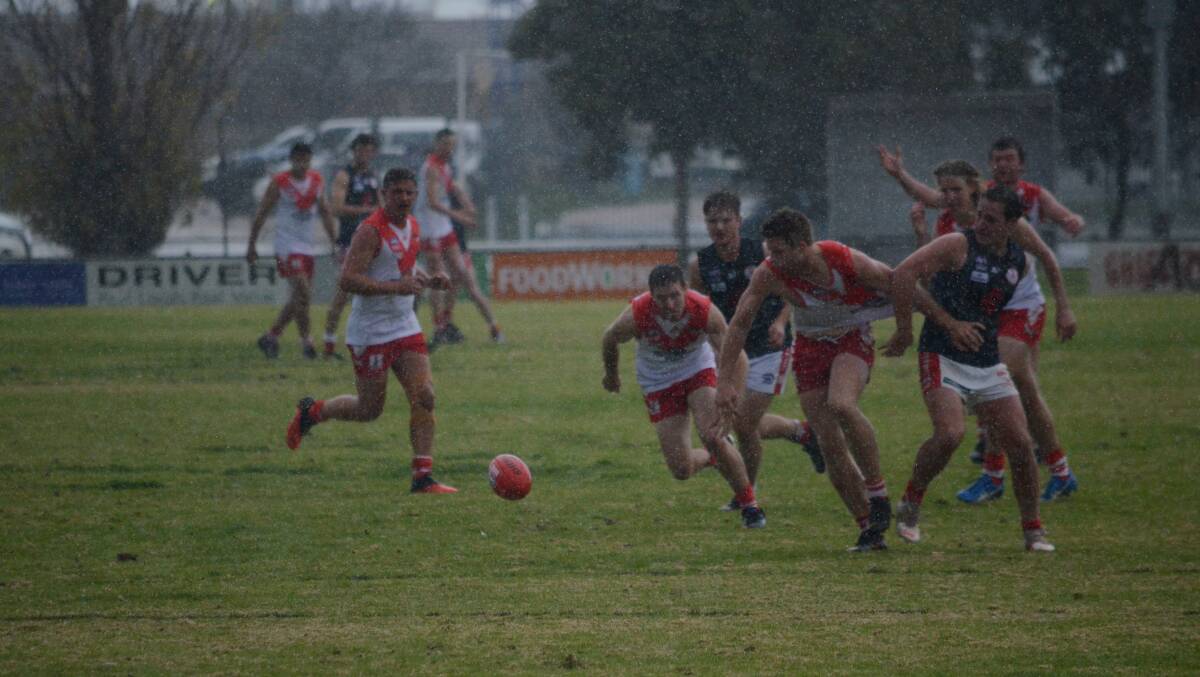 The heavens opened up in the third quarter of the Exies Sport Oval clash. PHOTO: Monty Jacka