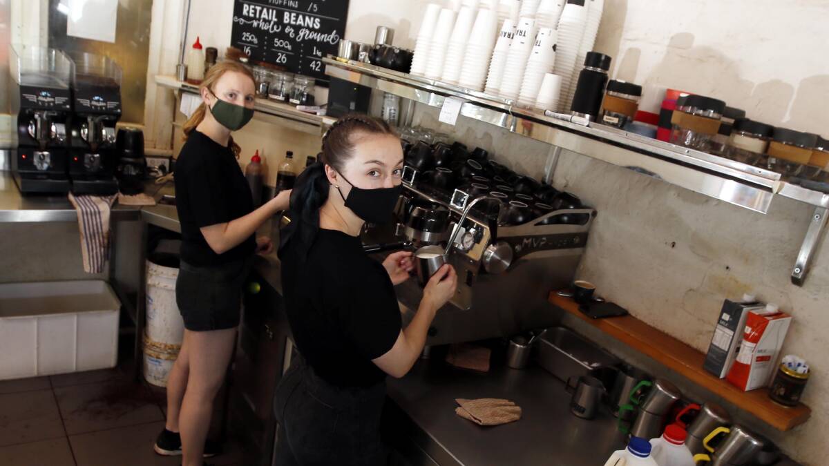 PRICE HIKE: Cappucinos, flat whites and more could soon cost more at local cafes like Trail Street Coffee Shop, where Lucy Bindon and Isabella Kirkby work as baristas. Picture: Les Smith.