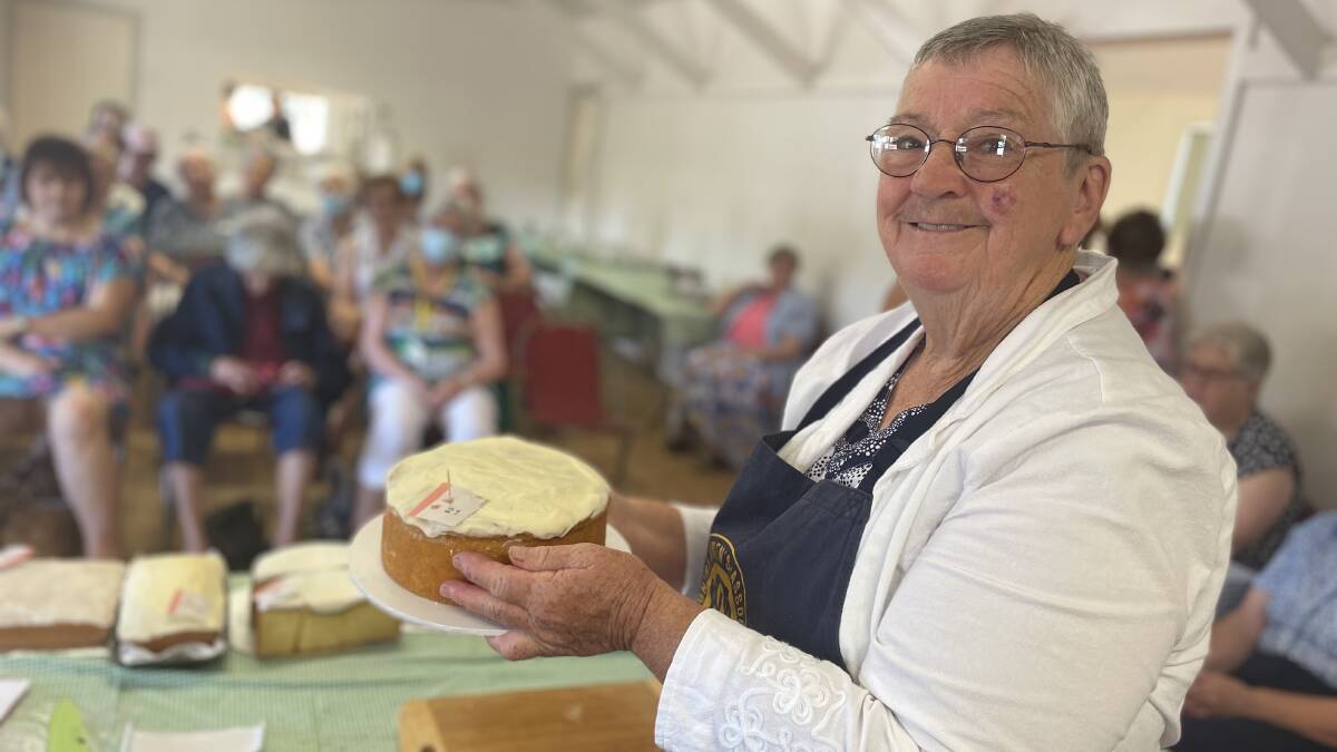 STANDARDS: Experienced judge Jan Young meticulously examined each entry in the Riverina CWA group's Land Cookery to determine the winners. Picture: Monty Jacka