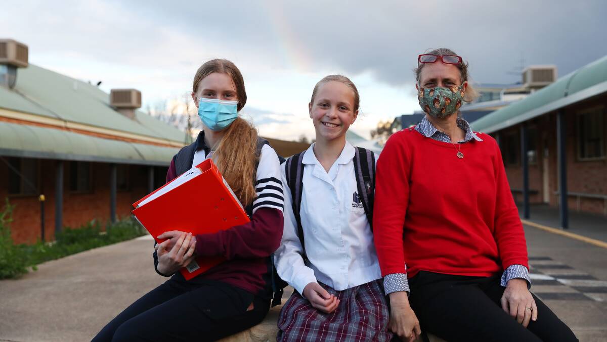 BACK IN ACTION: Amy, Abigail and Heidi Combs were excited to have face-to-face learning return to Wagga Wagga Christian College. Picture: Emma Hillier