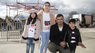 FAMILY: Iraqi-born Qasim Smoqi with his children Arjiwan, 7, Aylin, 10, and Ayyan, 3, at the Refugee Week celebration. Picture: Madeline Begley