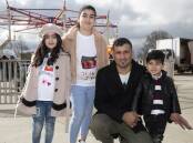 FAMILY: Iraqi-born Qasim Smoqi with his children Arjiwan, 7, Aylin, 10, and Ayyan, 3, at the Refugee Week celebration. Picture: Madeline Begley