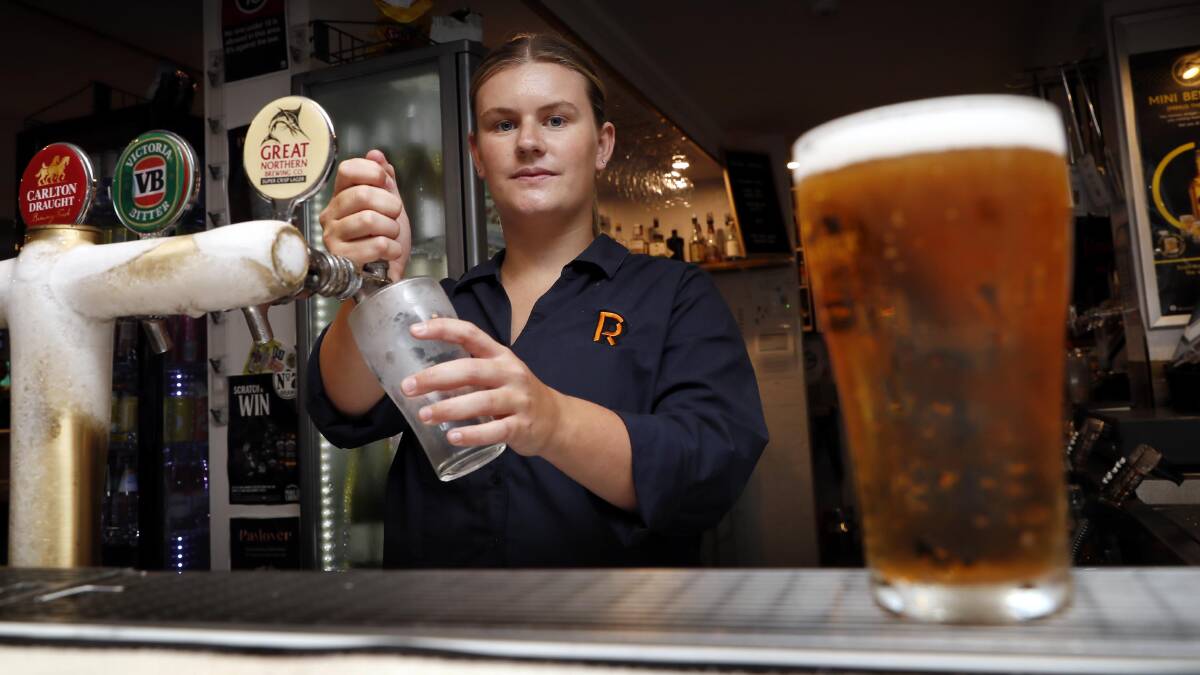 The cost of a schooner of beer, such as those poured by Romano's Hotel bar attendant Georgina Jenkins, could rise by up to 40 cents from February 1. Picture by Les Smith