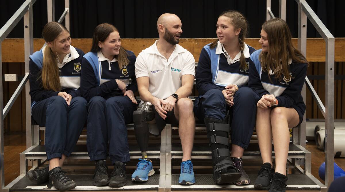 CONVERSATIONS: Scott Reardon with Wagga High School students Chelsea Clarke, Laila Cook, Shyanne Stanton and Holly Anderson. Picture: Madeline Begley
