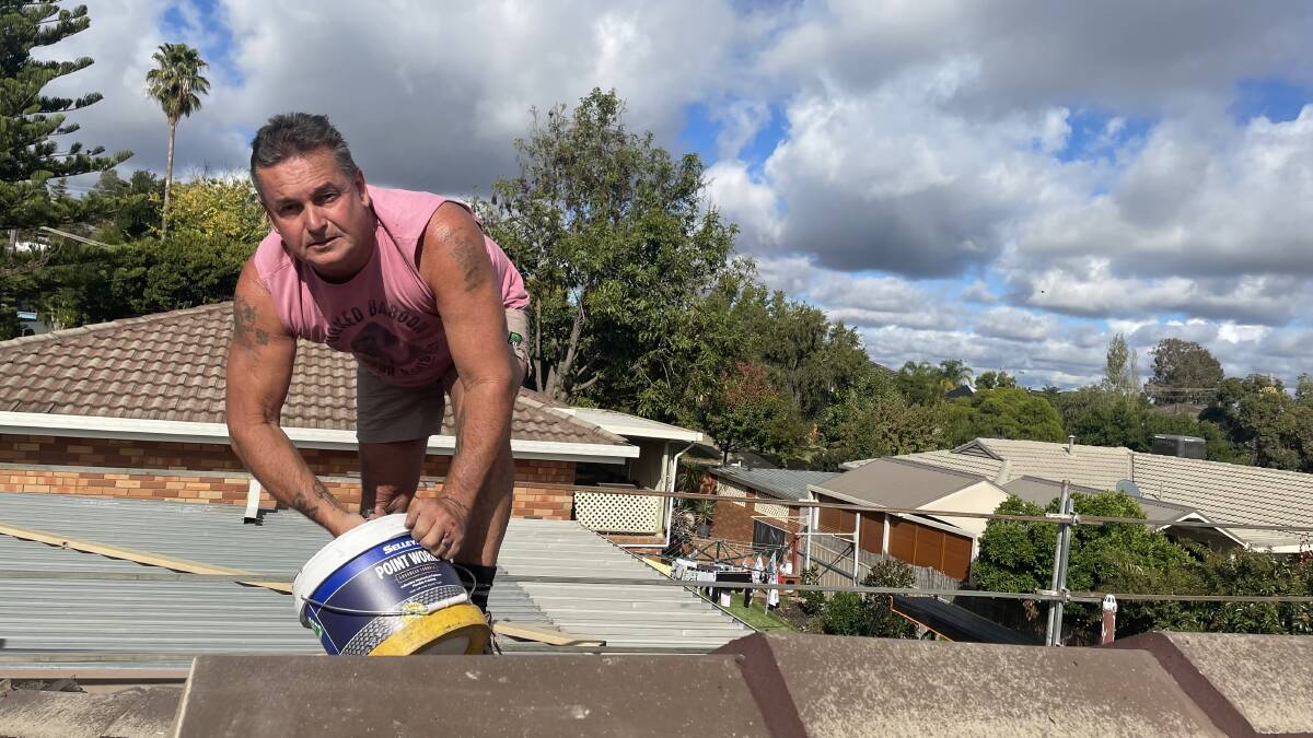HEAT STRESS: Wagga roof tiler Phil Whicker said working in the sun has become more demanding in recent years. Picture: Monty Jacka