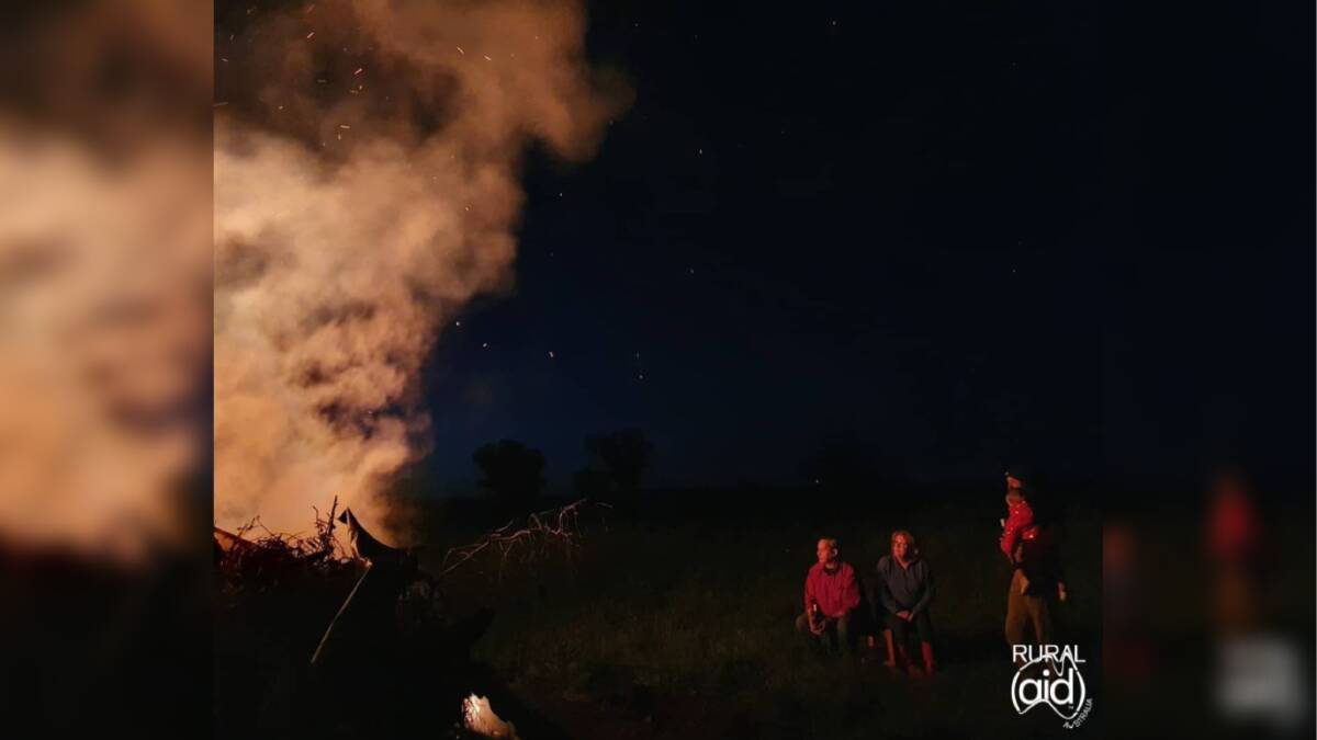 SOLACE: Ms Gaskin's competition-winning picture depicts her parents, brother-in-law and niece enjoying a night by the bonfire after a long, hard day. Picture: Monique Gaskin