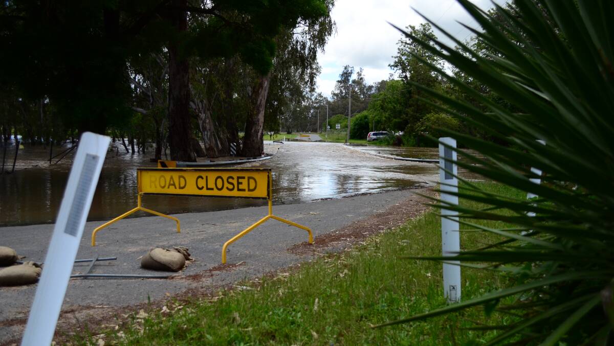 Floodwaters from the surging Murrumbidgee River cover a road in Gumly Gumly during the flooding event in early October. Picture by Monty Jacka