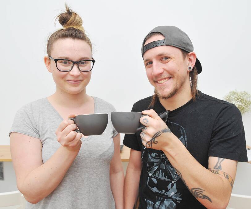 REMEMBERED: Emily Hartshorn and Justin Ferguson have a cuppa for Steph at Harans on Friday. Picture: Kieren L Tilly.
