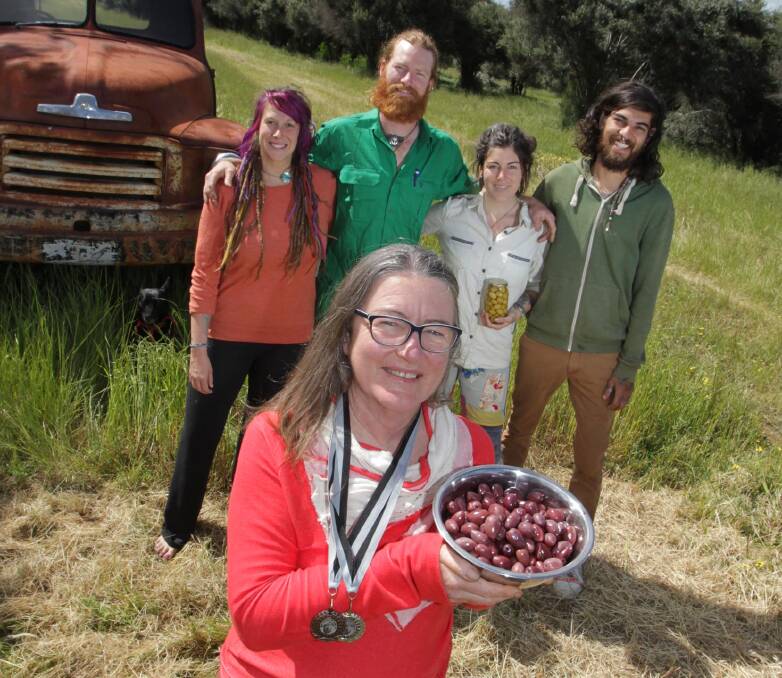 AWRDS: Margie Carter of Parafield Olives with Rachel Holan, Malcolm Grieve, Sally Carter and Kieran Alfonso-Moore and her award-winning olives. Picture: Les Smith.