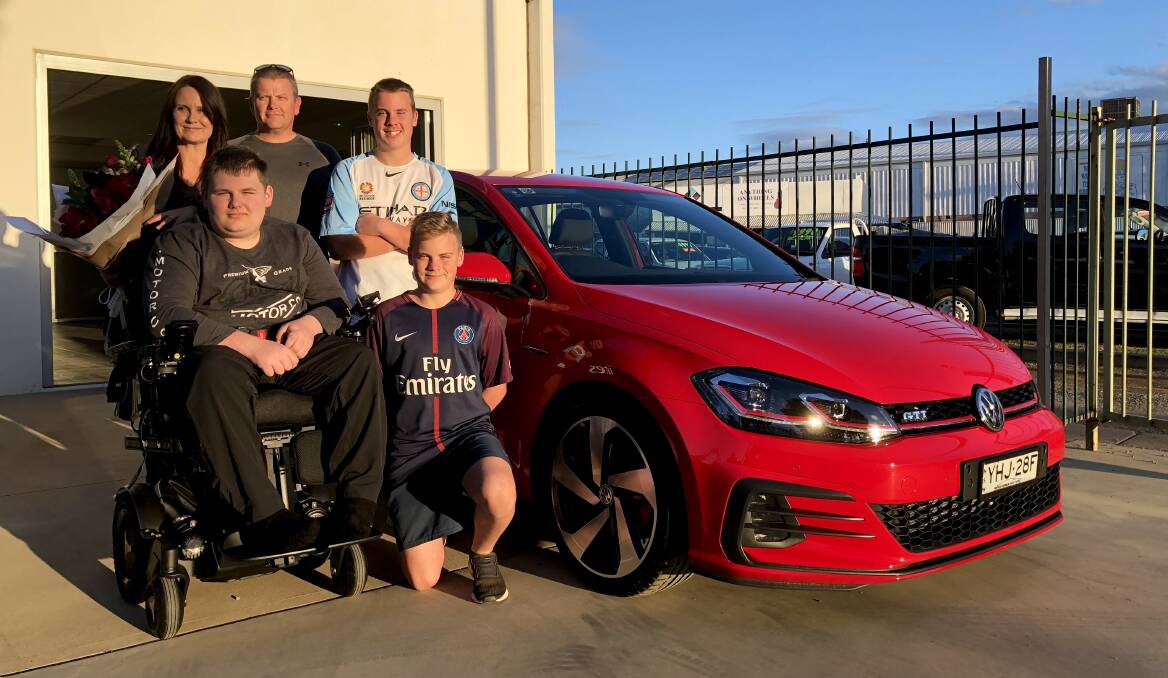 GRINNERS: Pauline and Mark Watson with their sons Jacob, Fletcher and Harrison, who couldn't believe their luck when they won a new car, initially thinking it must have been a scam. Picture: Stephen Mudd