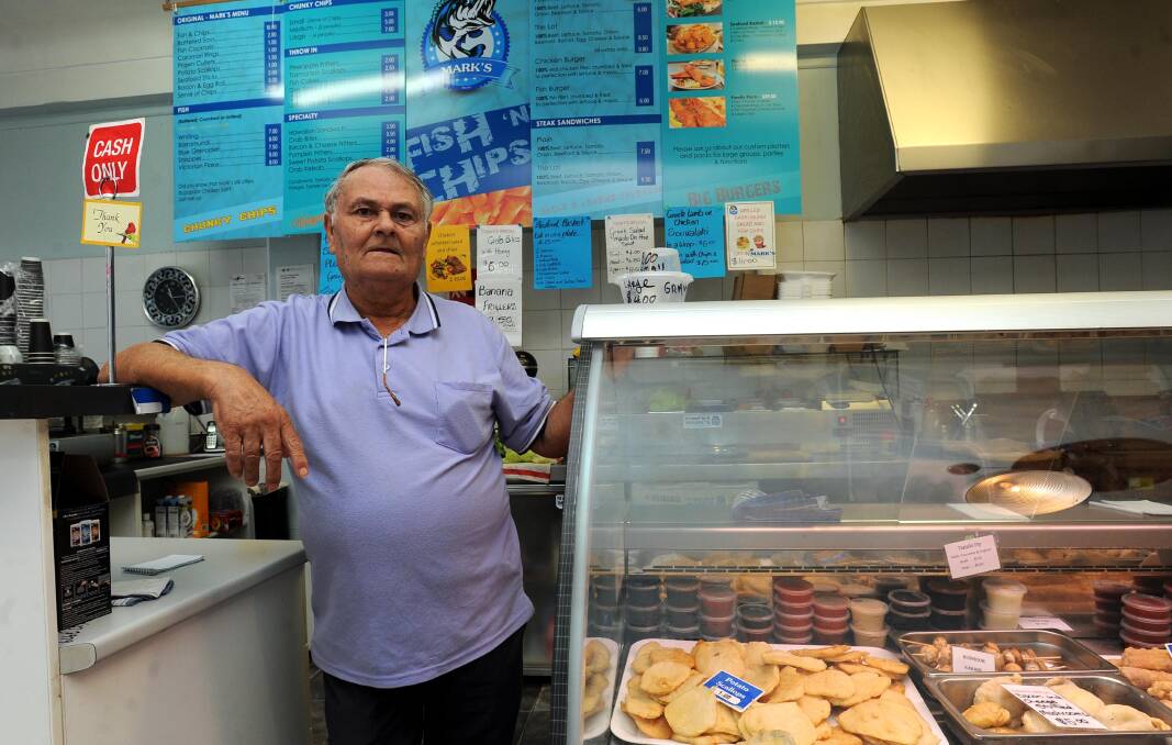 CLOSURE: Mark's Fish Shop owner Ilias Konstas at work in 2017. “I’m very close to my customers, they’re like a family," he said. Picture: Stephen Mudd