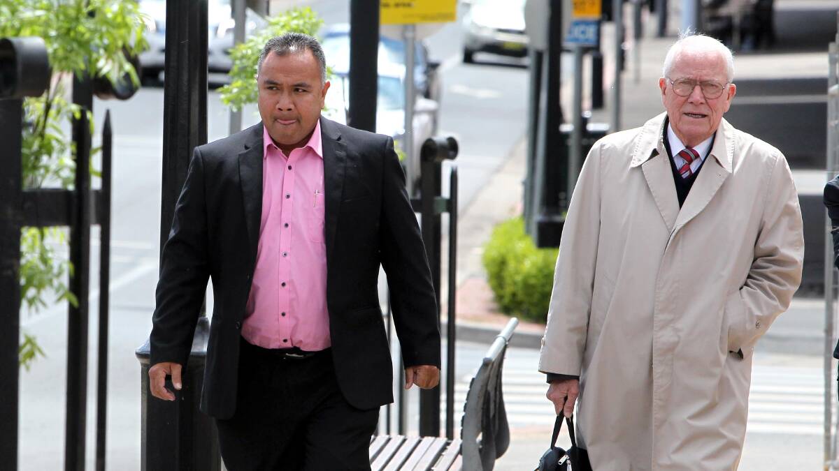 JUDGMENT: Father Neru Leuea about to enter court with his solicitor, Simon MacKenzie. Picture: Les Smith