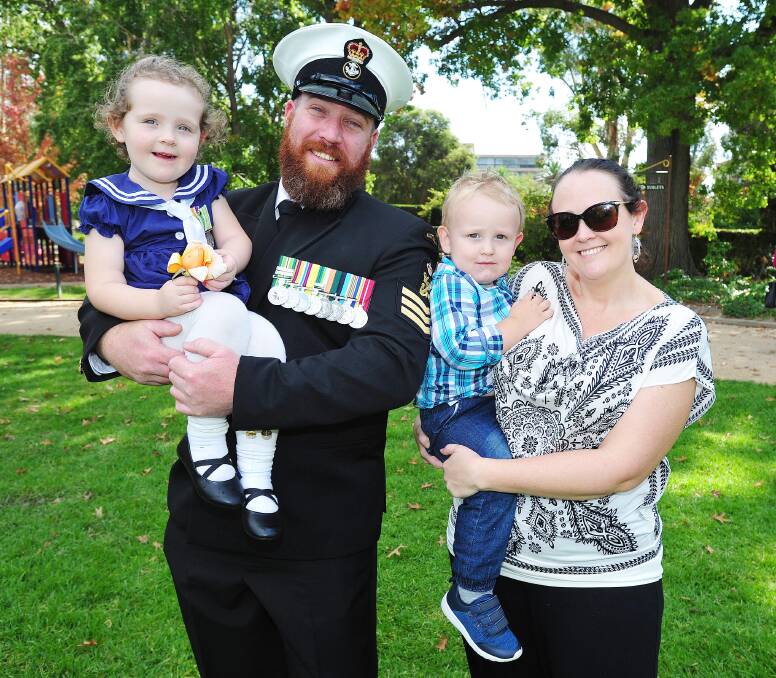 THANK YOU: Petty Officer Brent Anschaw with his daughter Olivia, son Harry and wife, Beth. Picture: Kieren L Tilly