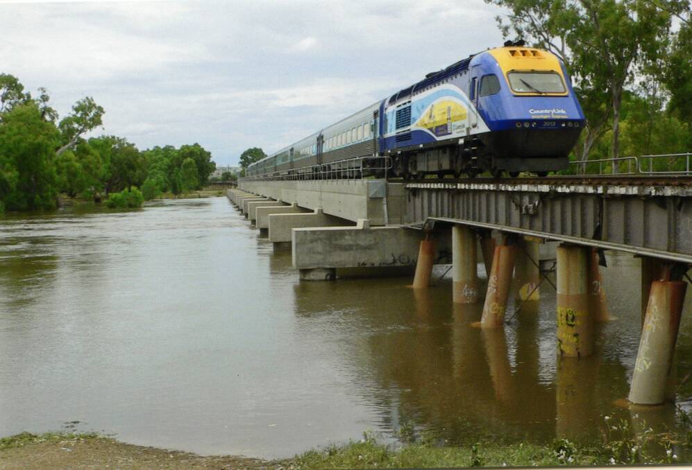OVERFLOWING: The XPT train pictured crossing a flooded Murrumbidgee River at Wagga Wagga. Picture: GEOFF HADDON
