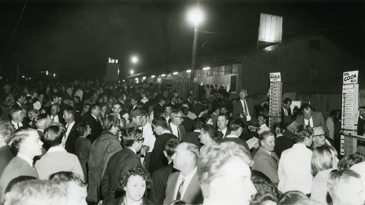 BACK THEN: A harness racing crowd at the Wagga Showground with bookmakers Bryan Nagle and Noel Cook to the right. Picture: CSURA 1574.569 LENNON COLLECTION