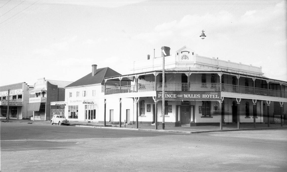MOMENt IN tIME: The original Prince of Wales Hotel on the corner of Kincaid and Fitzmaurice streets was built in 1865. In this picture, which was taken before its conversion to a motel in 1983, old businesses such as Bellings Motors, Hoskings Bakery and All Cars Co. are also visible. Picture: CSURA RW1574.253