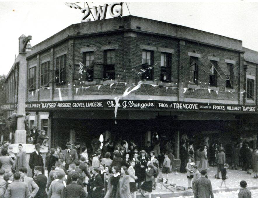 MOMENTOUS: Celebrations at the end of World War II outside the 2WG building in Fitzmaurice Street, Wagga in August 1945. Picture: SHERRY MORRIS