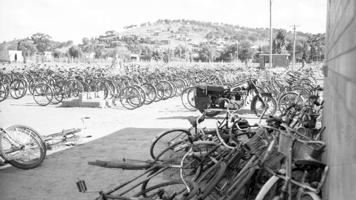 POPULAR: Many bicycles were lined up outside the Wagga City Baths when this photograph was taken in 1955. Picture: CSURA Lennon Collection RW1574.255