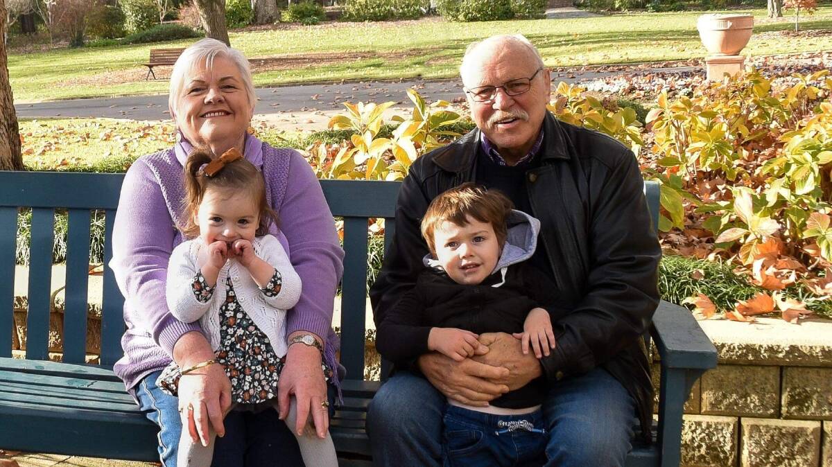 FAMILY: Barry Francis with his wife Chris and two grandchildren. Barry was well known for busking along the main street of Wagga. Picture: Contributed