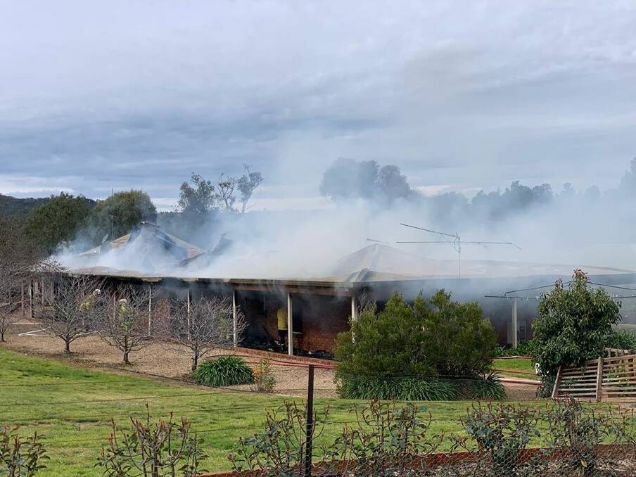 UP IN SMOKE: Fire crews battle the blaze at the Wagga Boarding Kennels which destroyed the house. Picture: Riverina RFS
