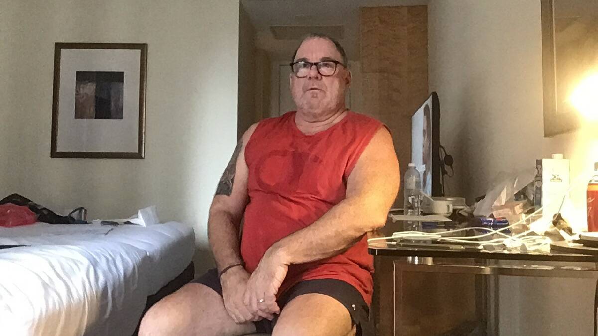 ISOLATED: John Reid in his hotel room at Sofitel Wentworth, which he has not been allowed to leave since Monday. Picture: Contributed