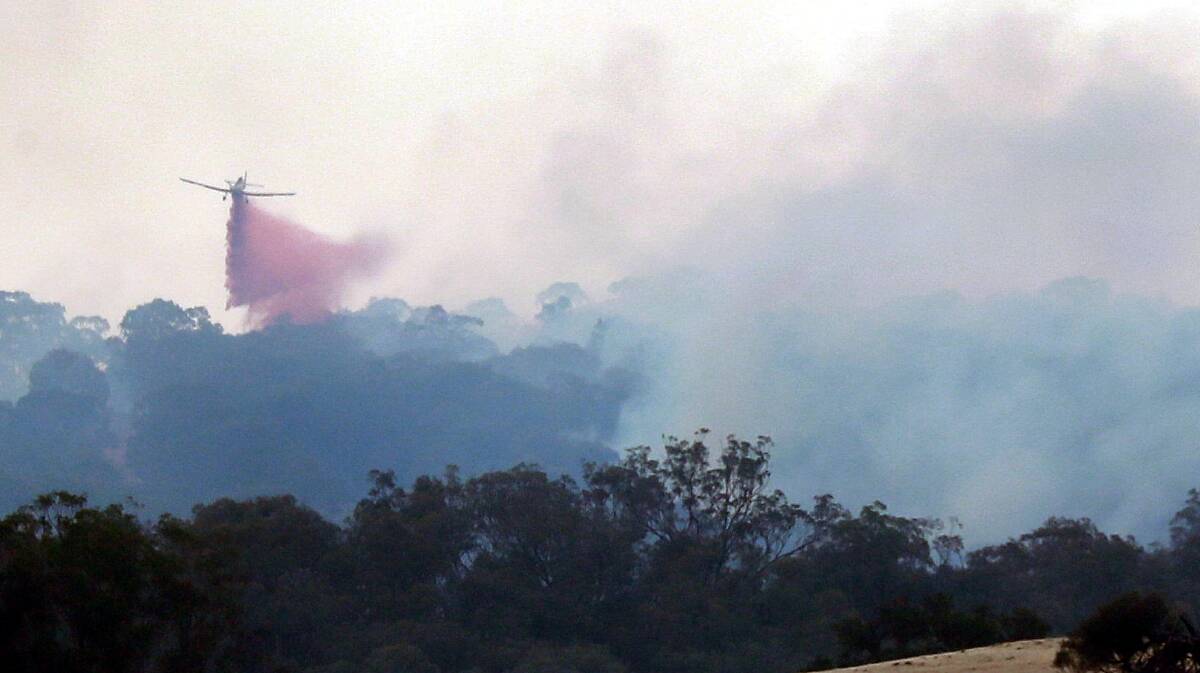 REMINDER: A bomber drops flame retardant on fires which took hold between Tarcutta and Adelong at the start of the year.