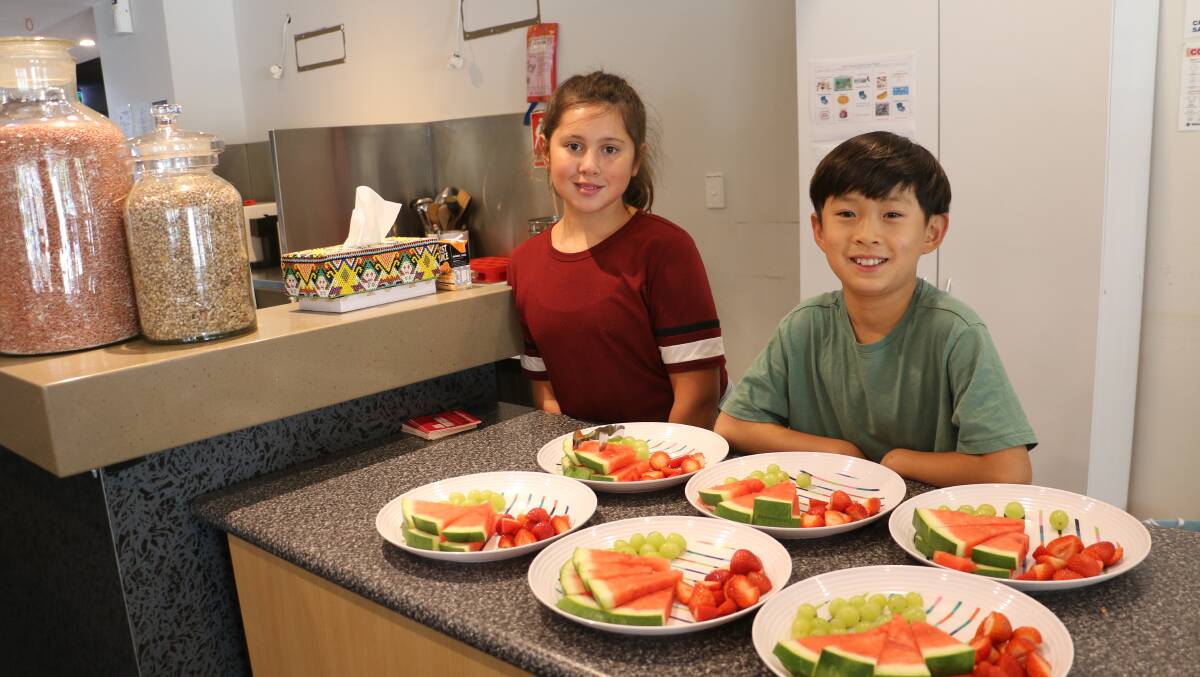 NEW LIFE: Juniper Clapham, 10, and John Yoo, 10, in the repurposed outside hours care kitchen area. Picture: Rachel McDonald