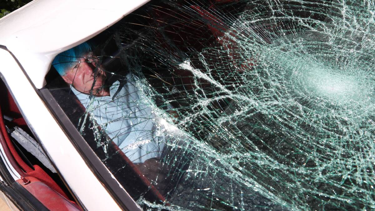 SMASHED: Keith Buchanan and his family woke to a group vandalising their old family limousine. Picture: Emma Hillier
