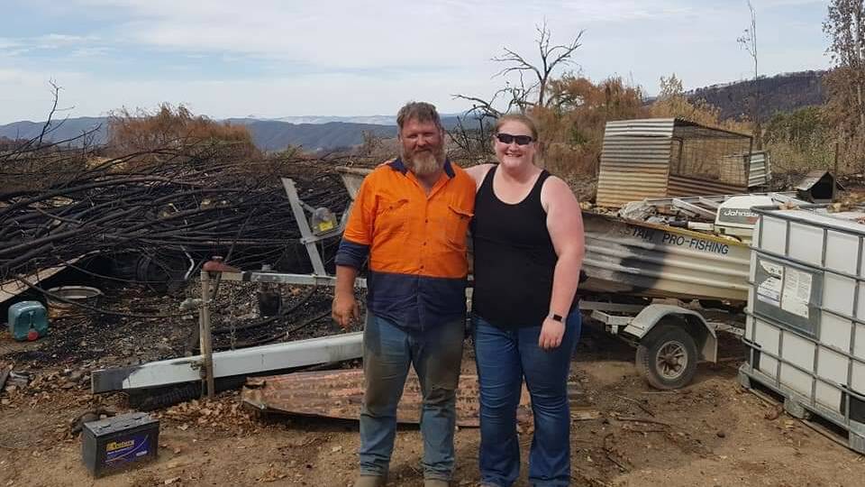 HELPING OUT: Steve Bellchambers with Adrienne Steward at his Batlow property which was destroyed by the bushfires. Picture: Contributed