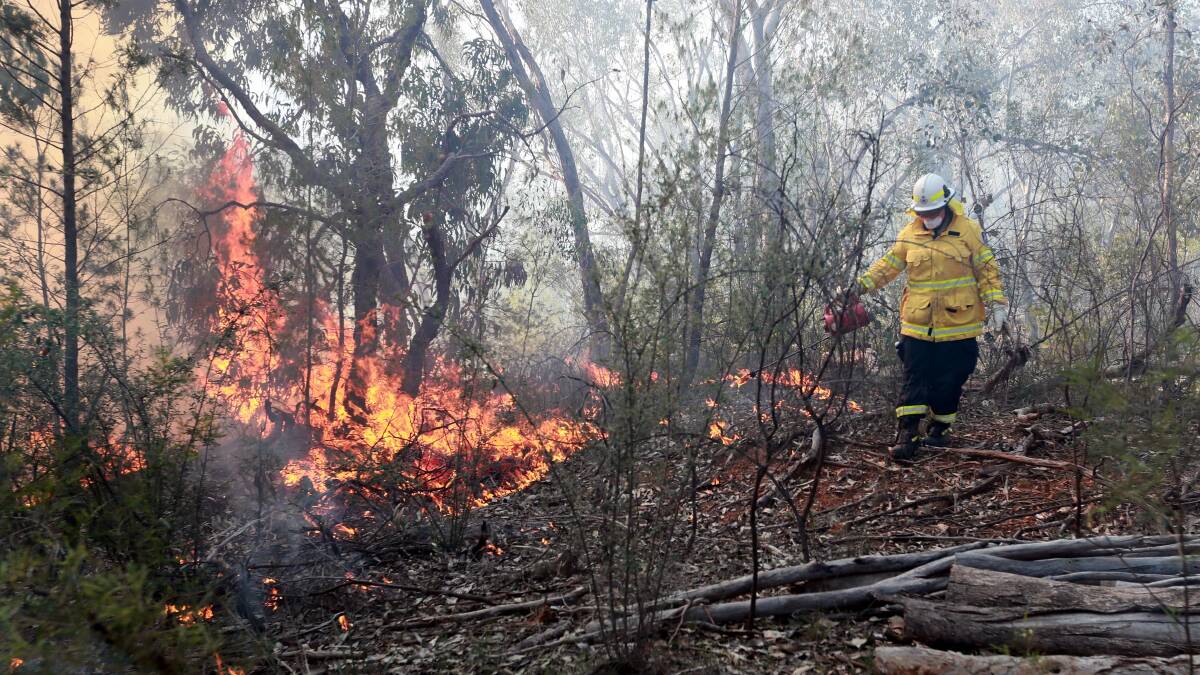 HANDS-ON: New Yarragundry RFS volunteer Jess Goldsworthy works on a hazard reduction burn at Willans Hill earlier this month. Picture: Les Smith