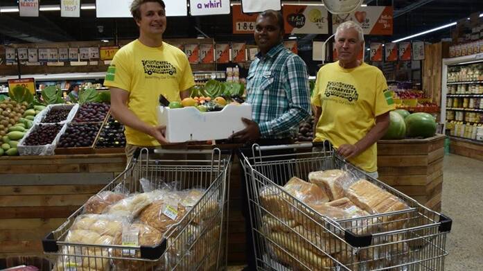 John Foord (right) pictured working with the OzHarvest Wagga team. Picture: Contributed