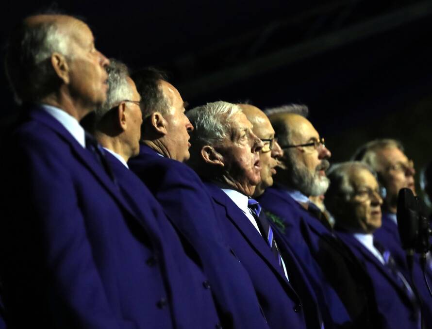 BACK TOGETHER: Wagga City Male Rugby Choir members sing at a pre-COVID Anzac Day service.