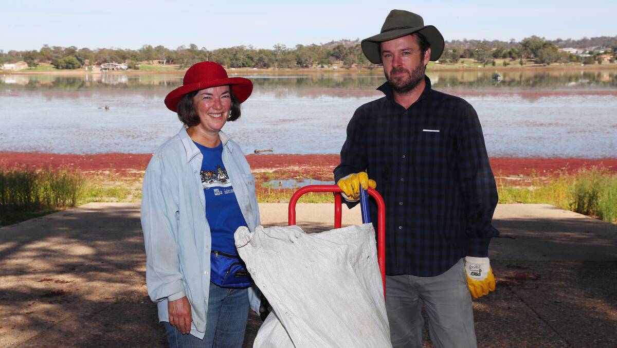 HELPING OUT: Genevieve Brady and Abe Worthington of Wagga do their bit to clean up the rubbish. Picture: Emma Hillier